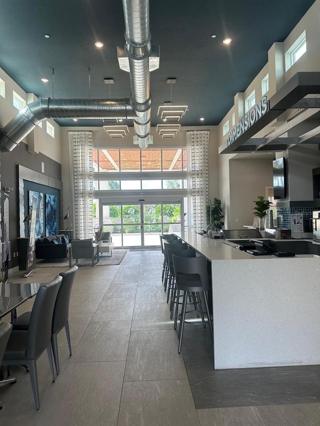 dining space with a high ceiling