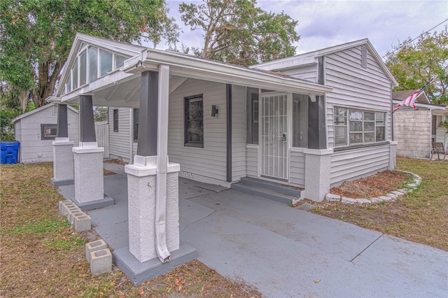 view of front of property with an outbuilding and covered porch