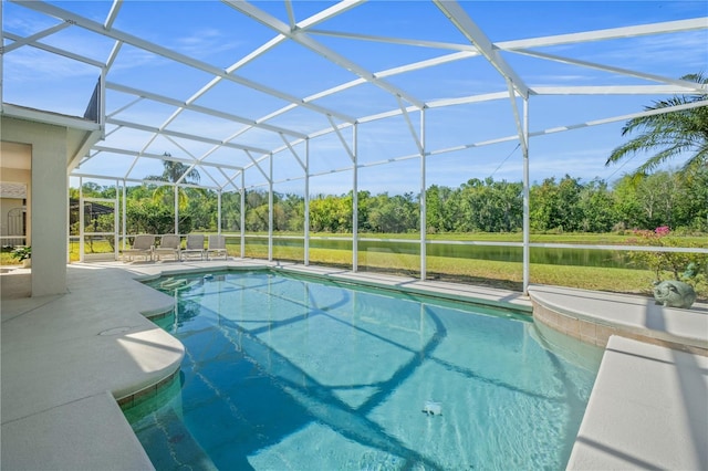 outdoor pool with glass enclosure and a patio