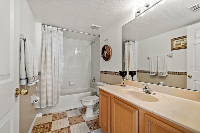 full bathroom featuring vanity, visible vents, shower / tub combo, a textured ceiling, and toilet