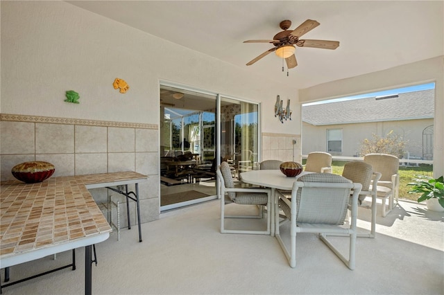 view of patio / terrace with outdoor dining space and a ceiling fan