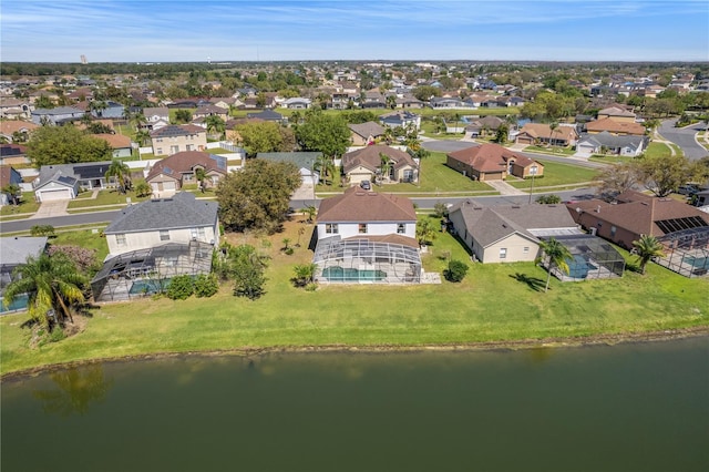 bird's eye view featuring a residential view and a water view