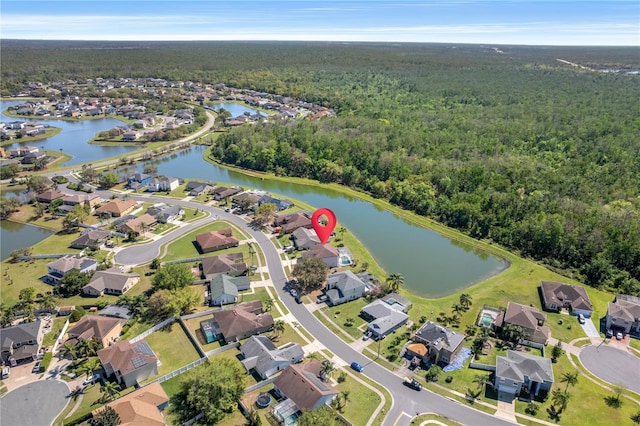 drone / aerial view with a water view and a residential view