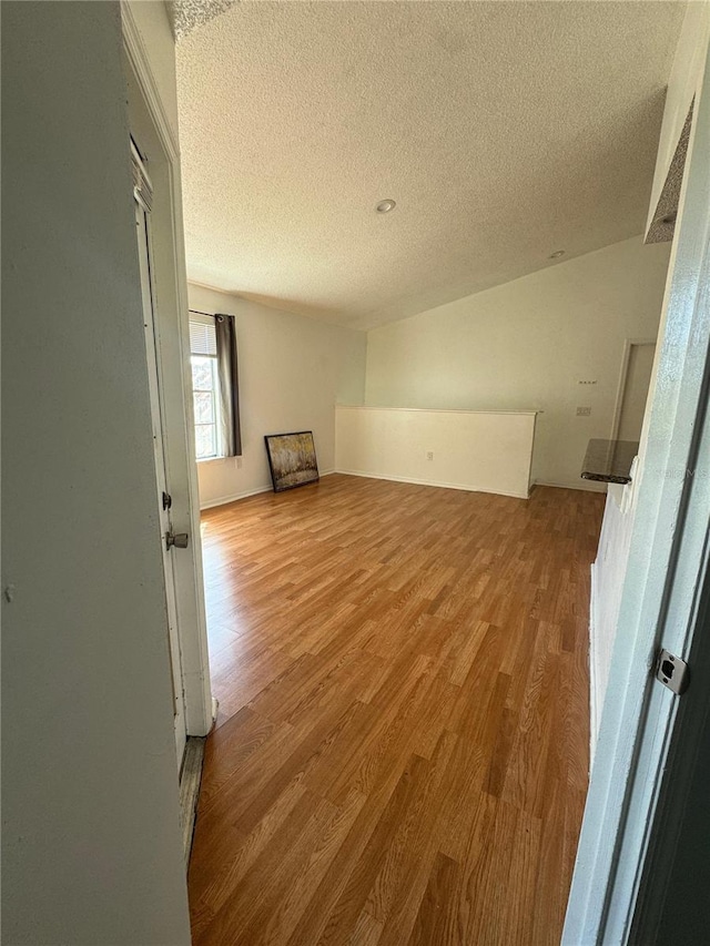 445 Fountainhead Cir Unit 264, Kissimmee, FL 34741 - spare room featuring a textured ceiling and wood finished floors