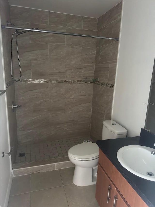 445 Fountainhead Cir Unit 264, Kissimmee, FL 34741 - bathroom with tile patterned floors, vanity, toilet, and a shower stall