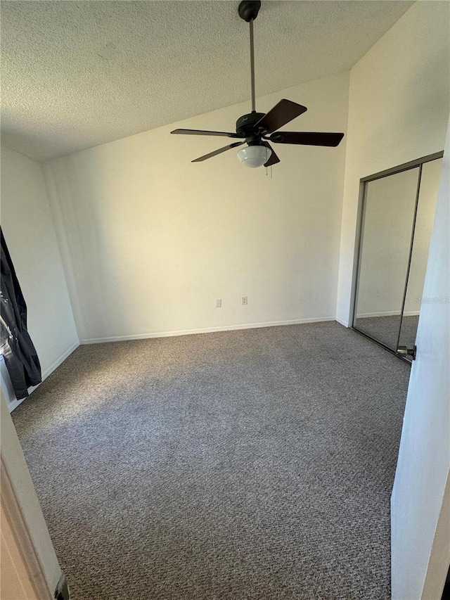 445 Fountainhead Cir Unit 264, Kissimmee, FL 34741 - interior space with carpet flooring, a textured ceiling, a ceiling fan, and vaulted ceiling