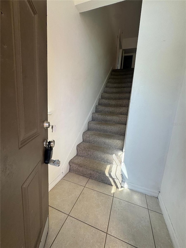 445 Fountainhead Cir Unit 264, Kissimmee, FL 34741 - stairway with tile patterned flooring and baseboards
