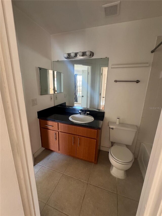 445 Fountainhead Cir Unit 264, Kissimmee, FL 34741 - bathroom featuring tile patterned floors, visible vents, toilet, and vanity