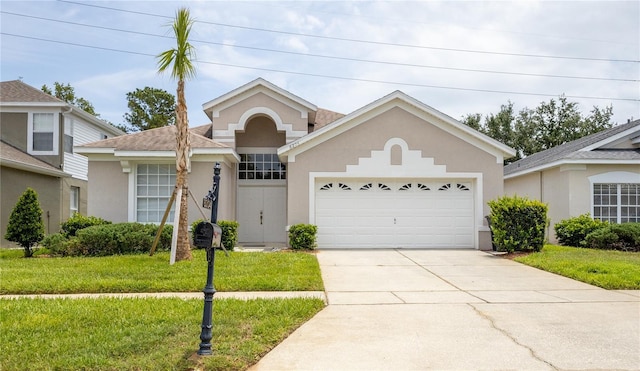 8204 Fan Palm Way, Kissimmee, FL 34747 - view of front of home with stucco siding, driveway, a front lawn, and a garage