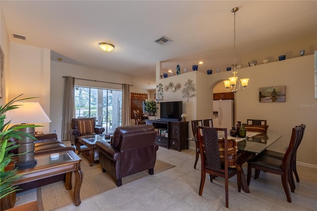 8204 Fan Palm Way, Kissimmee, FL 34747 - living area featuring light tile patterned floors, a chandelier, and arched walkways