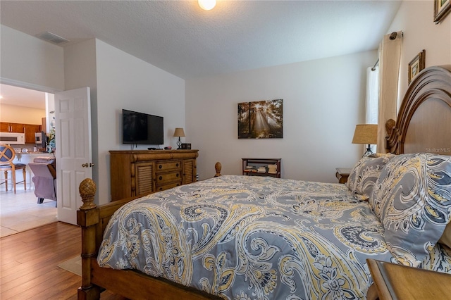 8204 Fan Palm Way, Kissimmee, FL 34747 - bedroom featuring wood finished floors