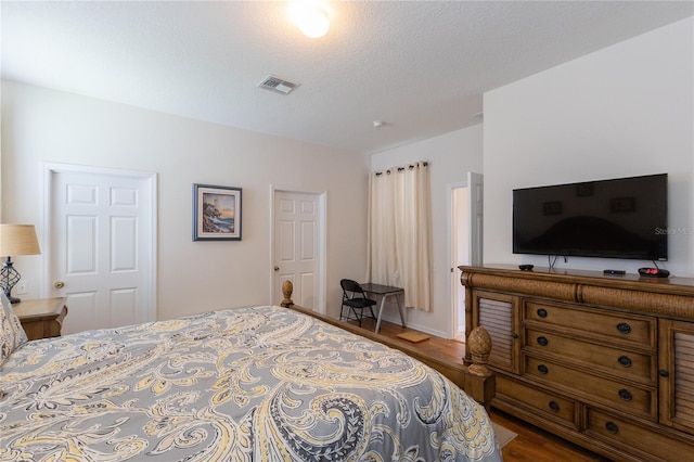 8204 Fan Palm Way, Kissimmee, FL 34747 - bedroom with dark wood-style floors