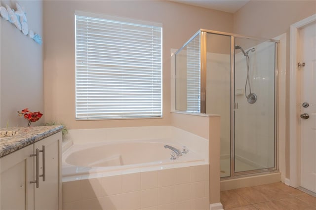 8204 Fan Palm Way, Kissimmee, FL 34747 - full bathroom with a bath, a shower stall, vanity, and tile patterned flooring