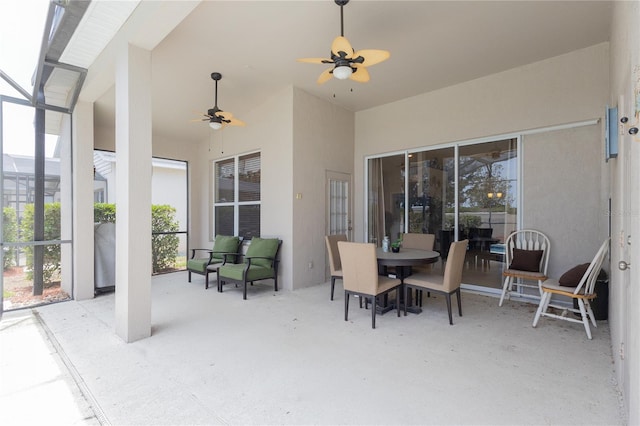 8204 Fan Palm Way, Kissimmee, FL 34747 - view of patio with ceiling fan, glass enclosure, and outdoor dining space