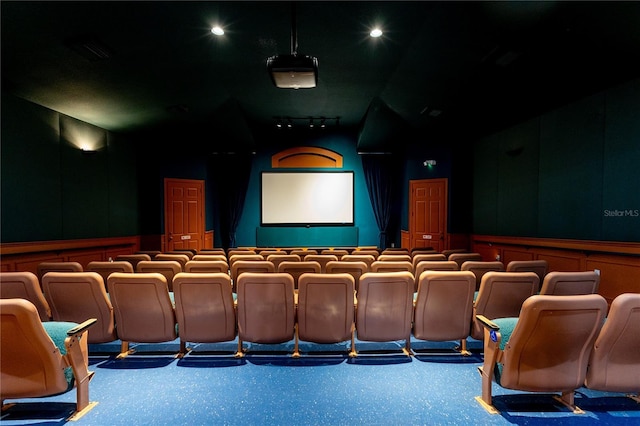 8204 Fan Palm Way, Kissimmee, FL 34747 - cinema featuring a decorative wall, vaulted ceiling, and wainscoting