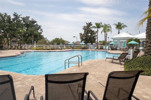 8204 Fan Palm Way, Kissimmee, FL 34747 - community pool featuring a patio