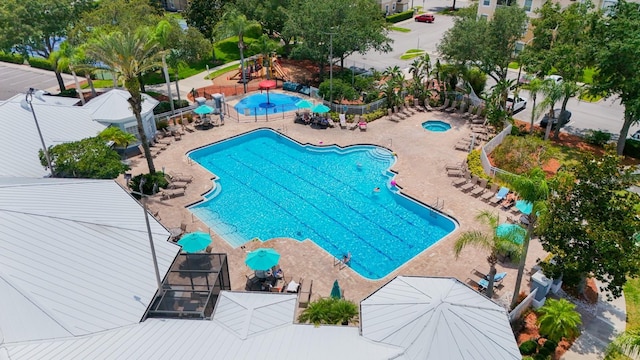 8204 Fan Palm Way, Kissimmee, FL 34747 - community pool with a patio area