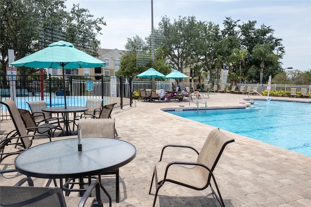 8204 Fan Palm Way, Kissimmee, FL 34747 - community pool with a patio area