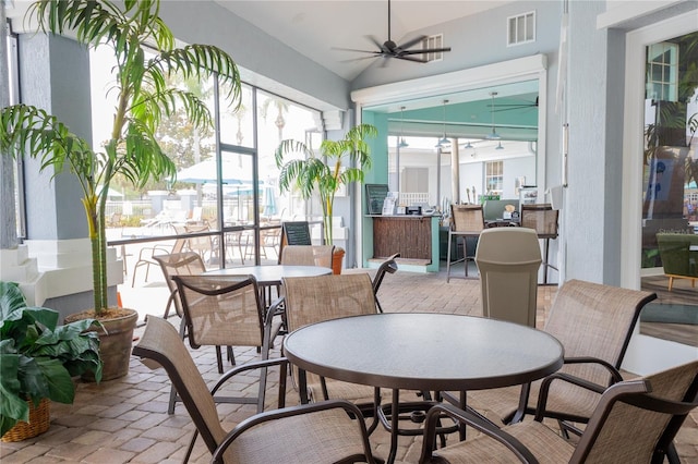 8204 Fan Palm Way, Kissimmee, FL 34747 - sunroom / solarium featuring vaulted ceiling