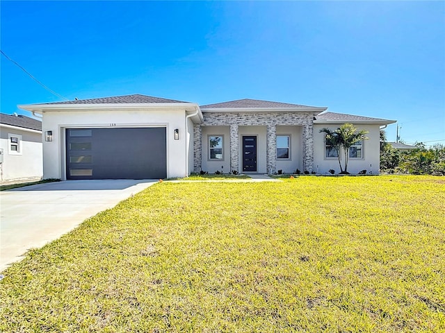 prairie-style house featuring a front lawn, concrete driveway, an attached garage, and stucco siding