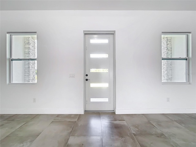 foyer entrance with baseboards