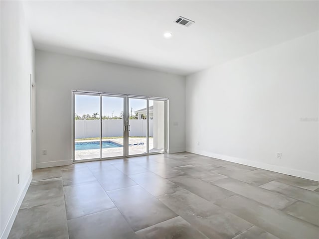 unfurnished room with visible vents, recessed lighting, and baseboards