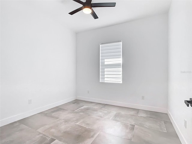 empty room with baseboards and ceiling fan