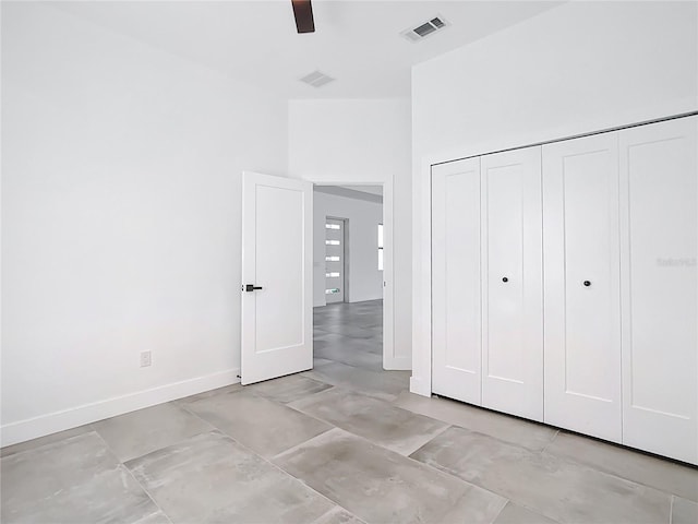 unfurnished bedroom with a ceiling fan, baseboards, visible vents, and a closet