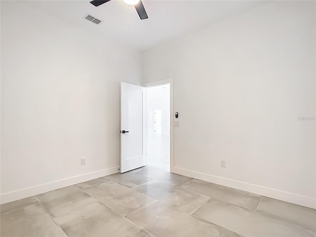 empty room with a ceiling fan, baseboards, and visible vents