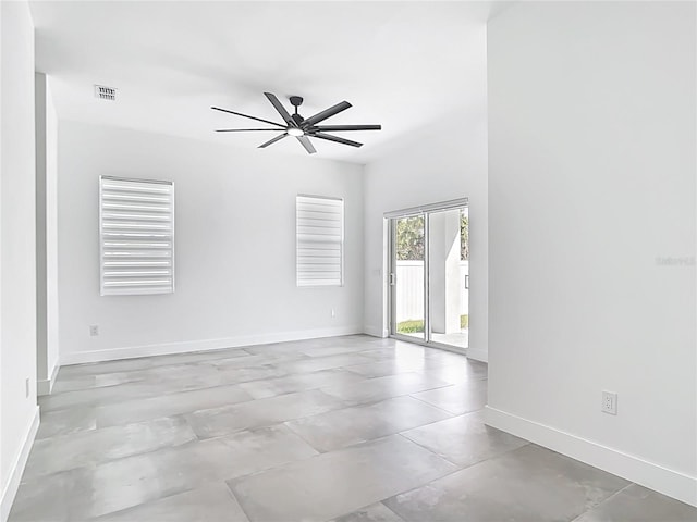 spare room featuring visible vents, baseboards, and ceiling fan