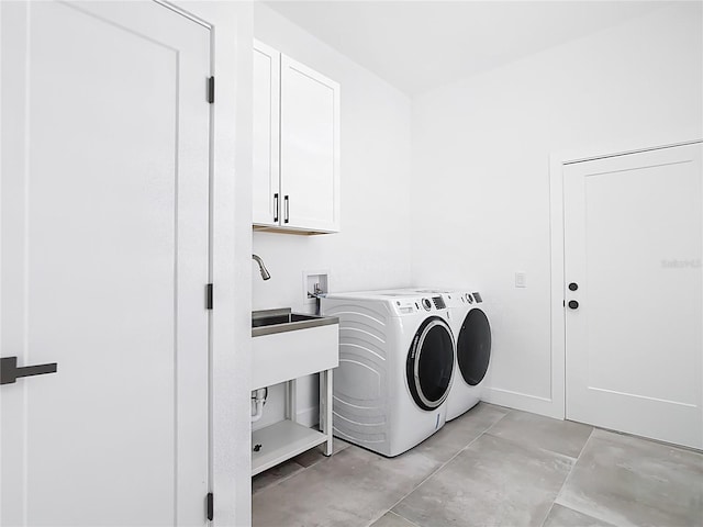 laundry room with washer and dryer and cabinet space