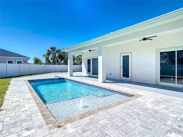 view of pool with ceiling fan, a patio, a fenced backyard, and a fenced in pool