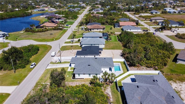 aerial view with a residential view and a water view