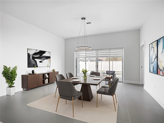 159 Antilla Dr, Rotonda West, FL 33947 - dining area with baseboards and concrete floors