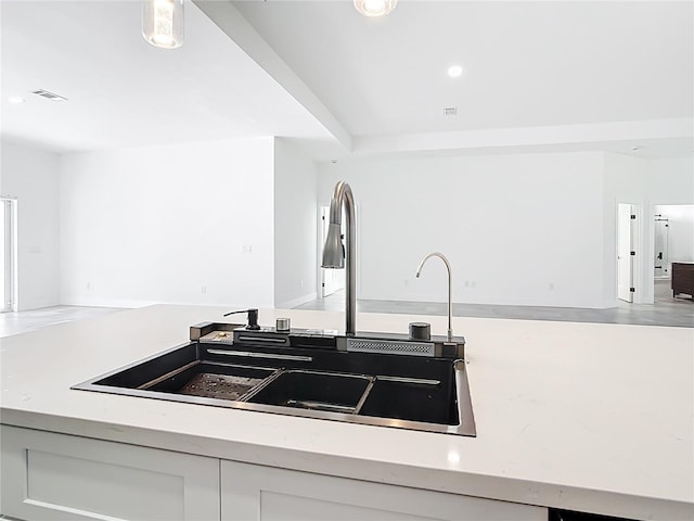 159 Antilla Dr, Rotonda West, FL 33947 - kitchen featuring open floor plan, recessed lighting, a sink, and white cabinetry