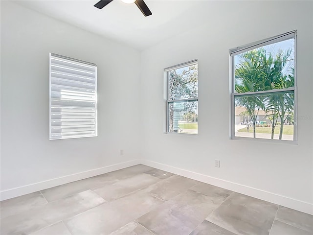 159 Antilla Dr, Rotonda West, FL 33947 - empty room with a ceiling fan and baseboards