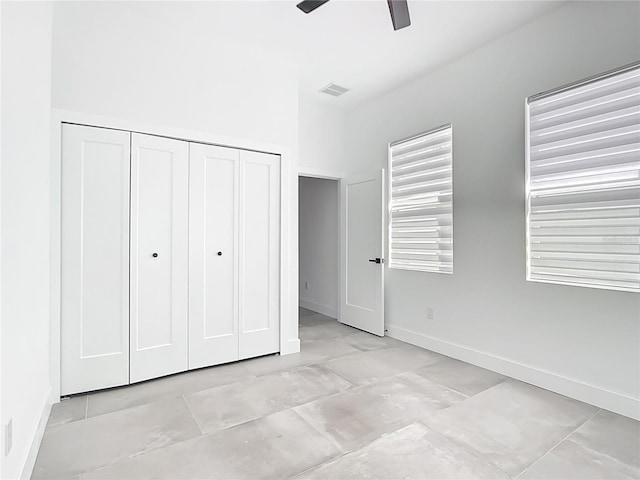 159 Antilla Dr, Rotonda West, FL 33947 - unfurnished bedroom with a closet, baseboards, and a ceiling fan