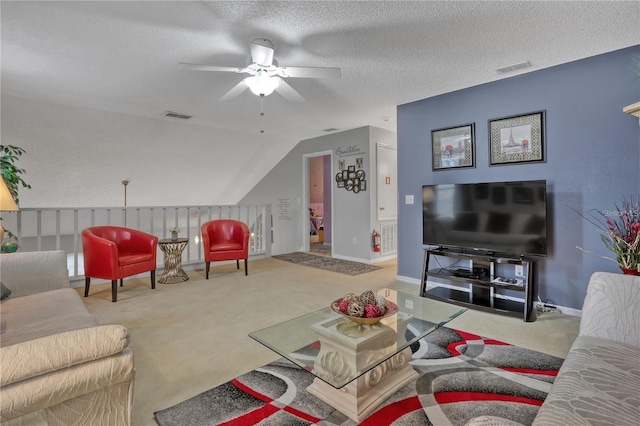 living room with a textured ceiling, carpet flooring, visible vents, and lofted ceiling