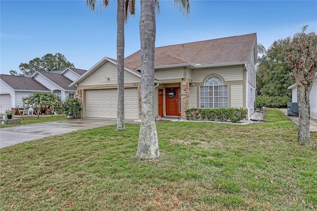 view of front of house featuring a garage, driveway, a shingled roof, a front lawn, and central AC