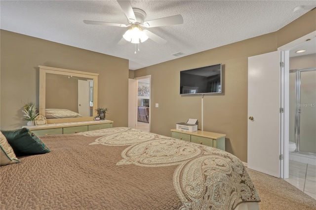 bedroom with visible vents, ceiling fan, a textured ceiling, and light tile patterned floors