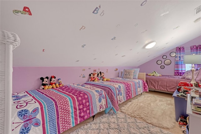 bedroom with vaulted ceiling, carpet, and visible vents