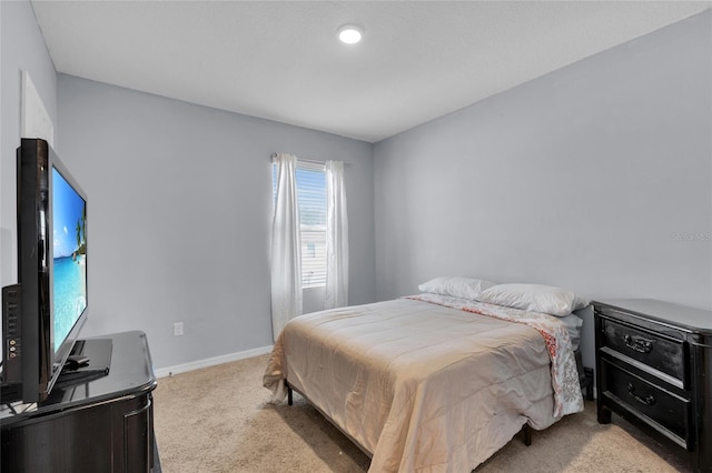 carpeted bedroom with baseboards