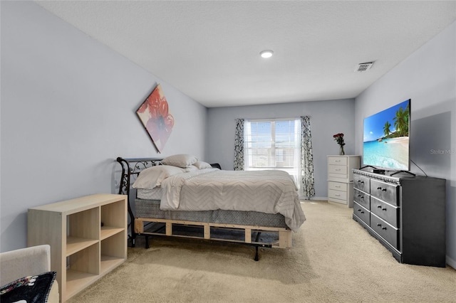 bedroom with carpet and visible vents