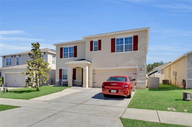 view of front of home with stucco siding, concrete driveway, a garage, and a front yard