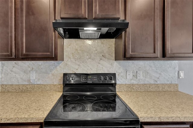 260 Willow Bend Dr, Davenport, FL 33897 - kitchen with range with electric cooktop, ventilation hood, light countertops, and decorative backsplash