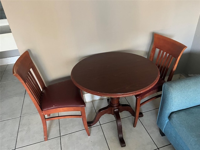 dining space featuring tile patterned floors