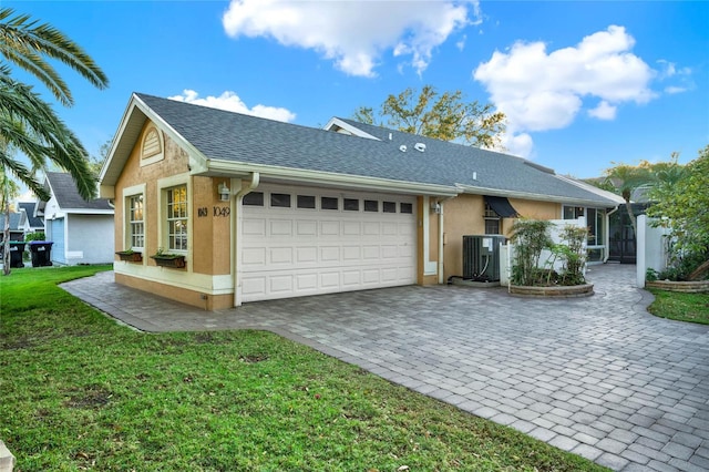 ranch-style house with central air condition unit, a garage, decorative driveway, stucco siding, and a front lawn