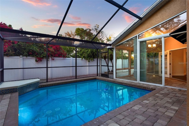 view of pool with a fenced in pool, a lanai, a fenced backyard, and a patio