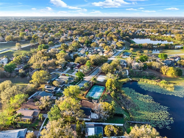 drone / aerial view featuring a water view and a residential view