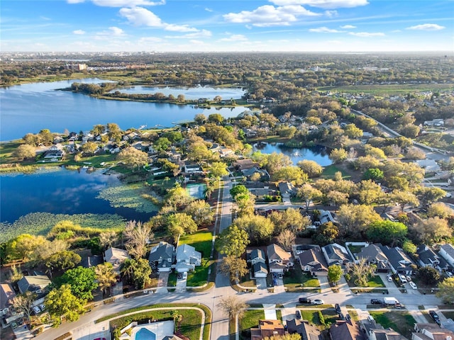 drone / aerial view with a residential view and a water view